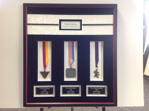 Marathon Medals framed in a shadowbox with 4 engraved plates