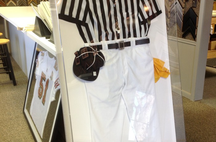 Referee uniform framed in plexiglass box