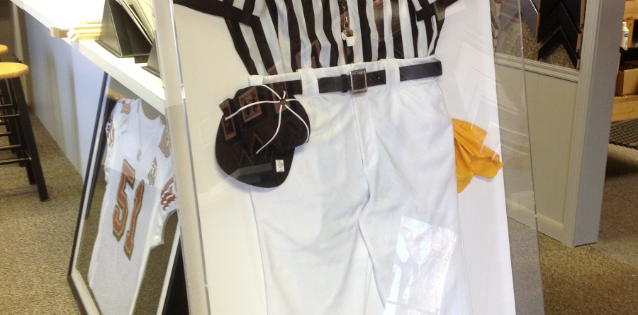 Referee uniform framed in plexiglass box