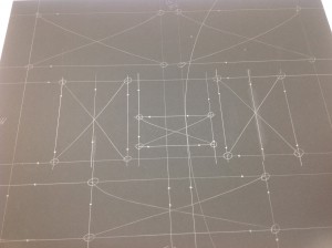 Framing process begins with calculating spaces for mat cut outs.