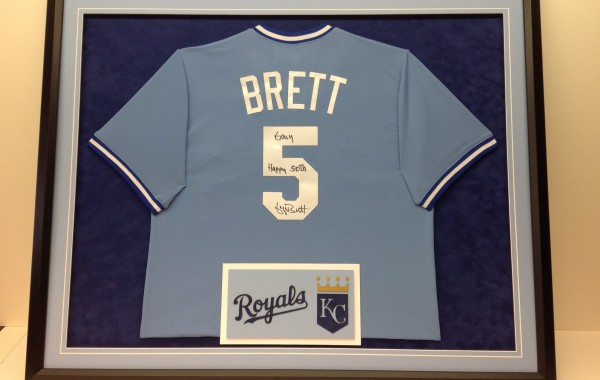 George Brett jersey framed with Kansas City Royals logo