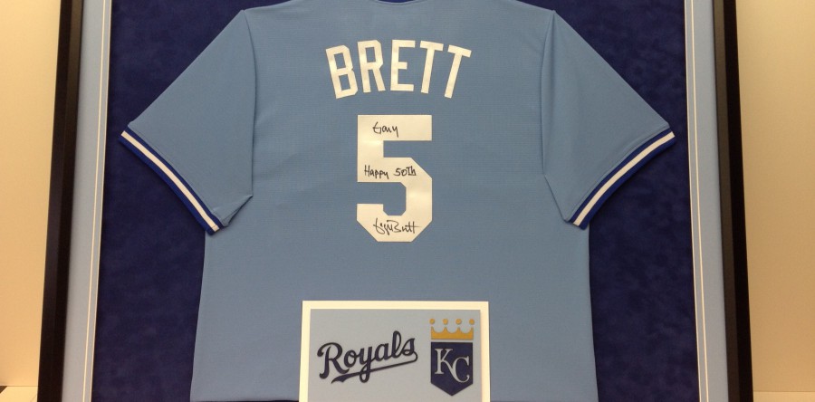 George Brett jersey framed with Kansas City Royals logo